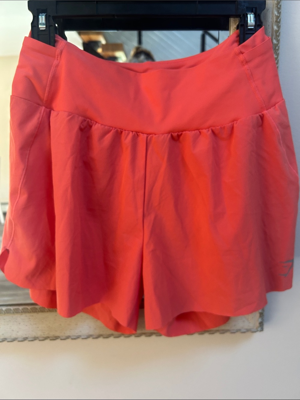 Gymshark Coral Pink Flared Active Skort pockets to hold gels